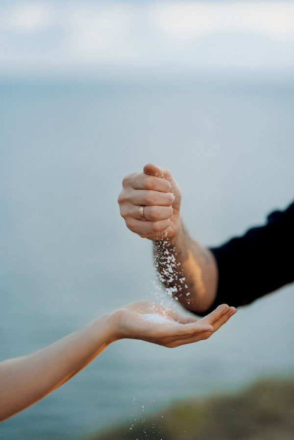 close-up-hand-holding-ice-sea